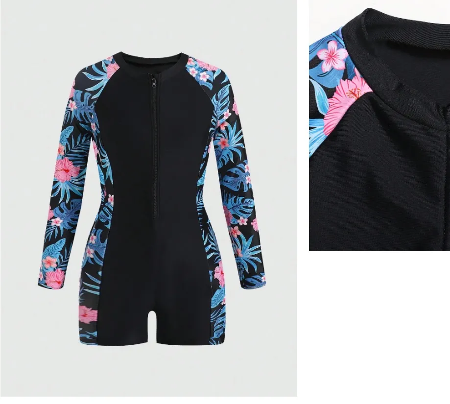 Traje de baño enterizo niñas, negro con estampado de hojas celeste y rosa a los costados