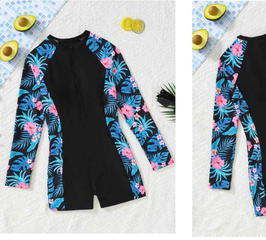 Traje de baño enterizo adolescentes, negro con estampado de hojas celeste y rosa a los costados